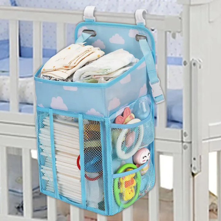 Organizator multifunctional pentru patutul  bebelusului, Zola®, posibilitate de agatare, inlude carlige, pliabil, albastru, model cu norosori,  43x28x20 cm