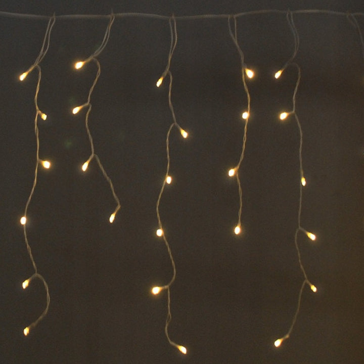 Instalatie de Craciun, Zola®, perdea curgatoare cu franjuri inegale, 500 leduri, lumina calda, impermeabilitate IP44, lungime totala 20.65 m, 230V